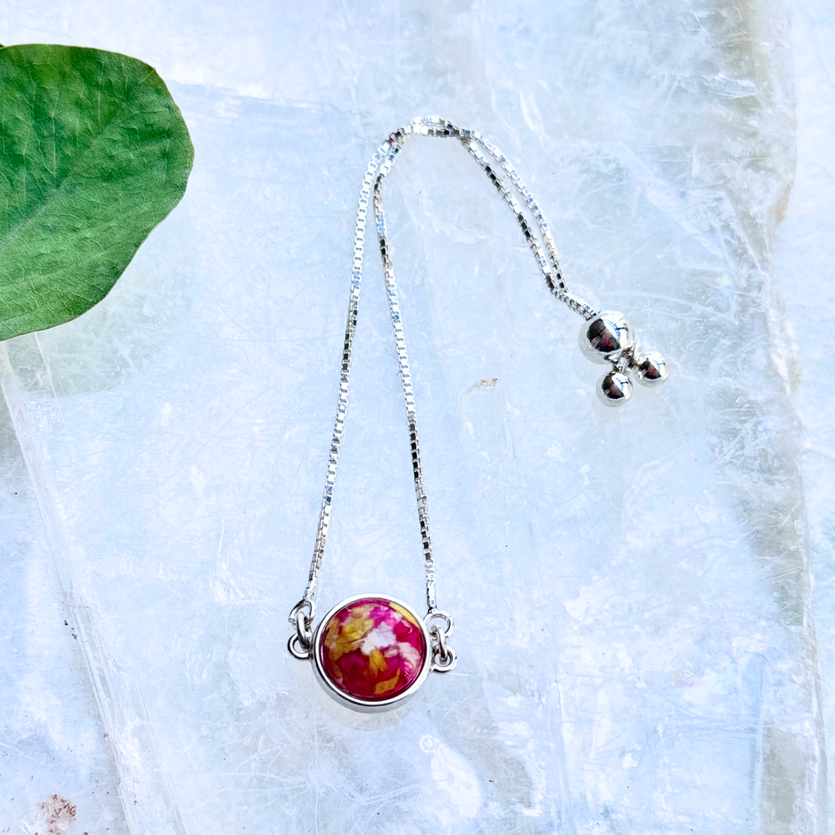 A front view of the Harmony Memorial Bracelet, showcasing its adjustable sterling silver chain (up to 8.5 inches) and handcrafted funeral flower bead. A timeless remembrance bracelet for honoring loved ones.