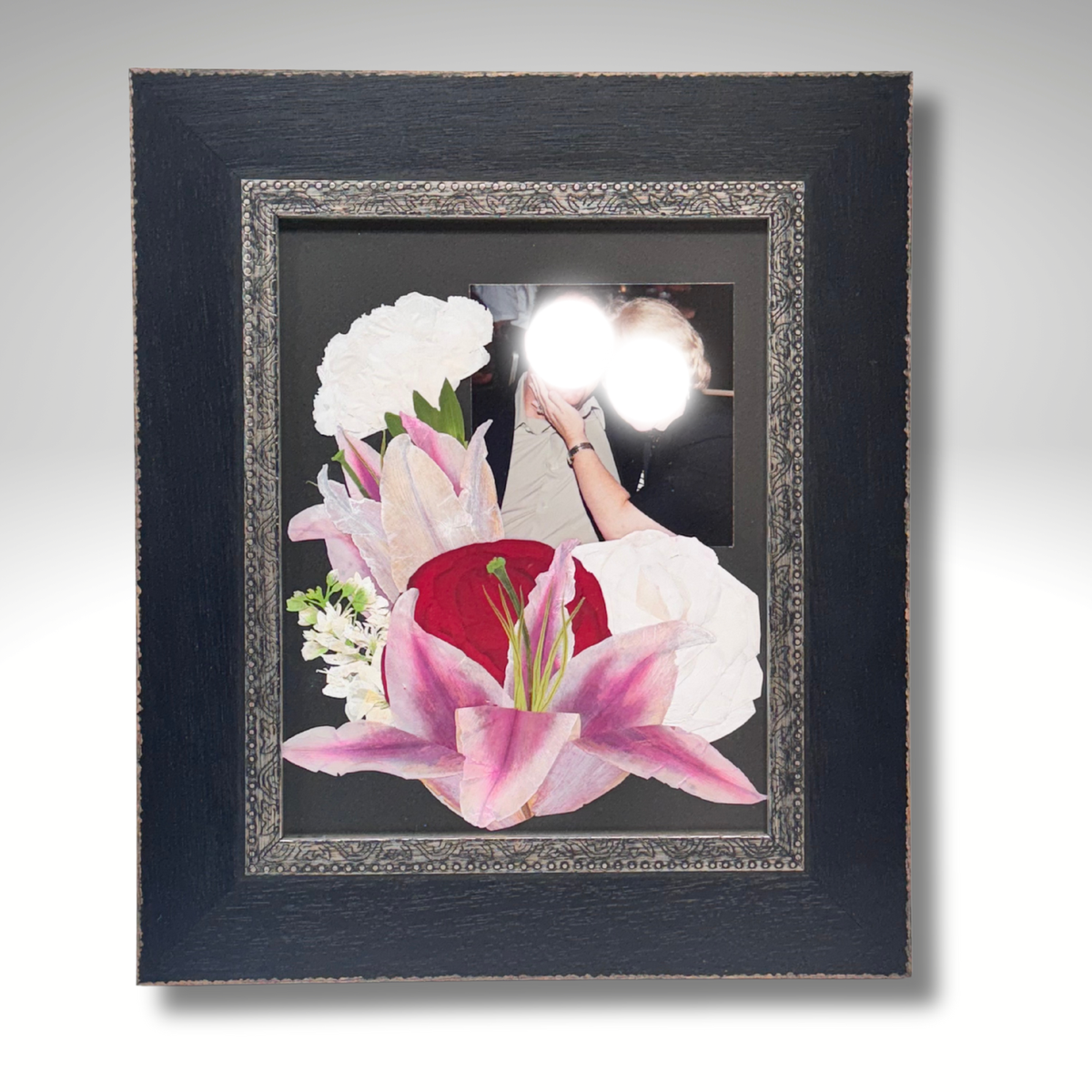 8x10 memorial frame featuring preserved funeral flowers including pink lilies and red rose, arranged around a personal photo in a black ornate frame.