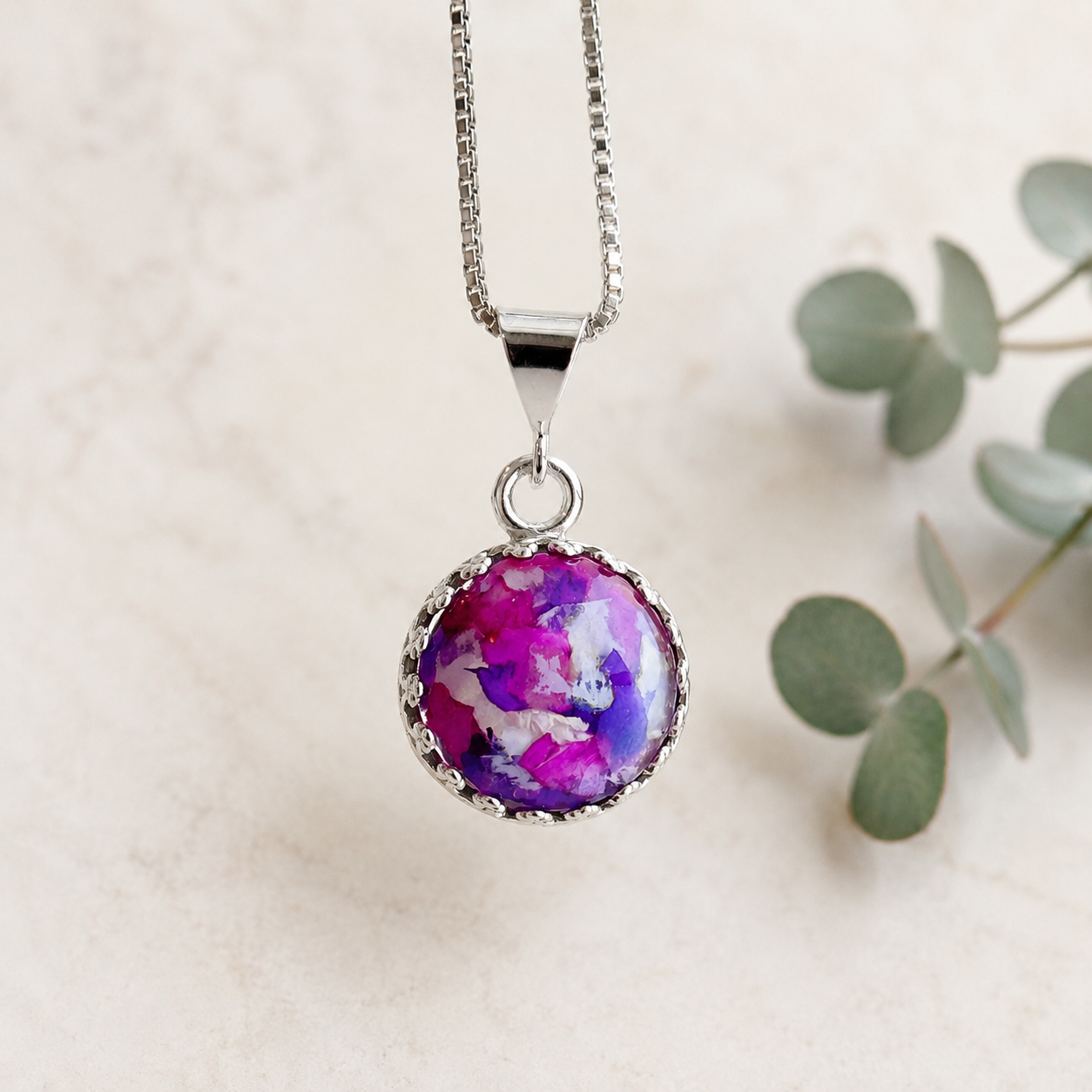 Blossom of Memories 12mm Pendant handcrafted in sterling silver with preserved wedding flowers or funeral flowers, creating a custom memorial keepsake necklace with a round floral design.