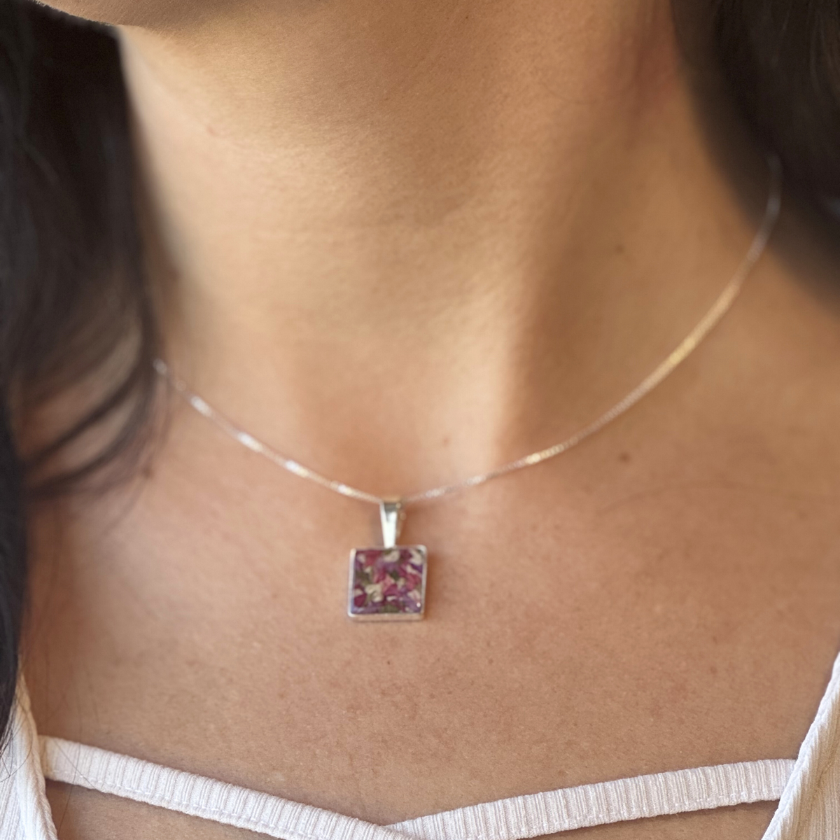  Model wearing the Cherished Square Pendant with preserved flowers