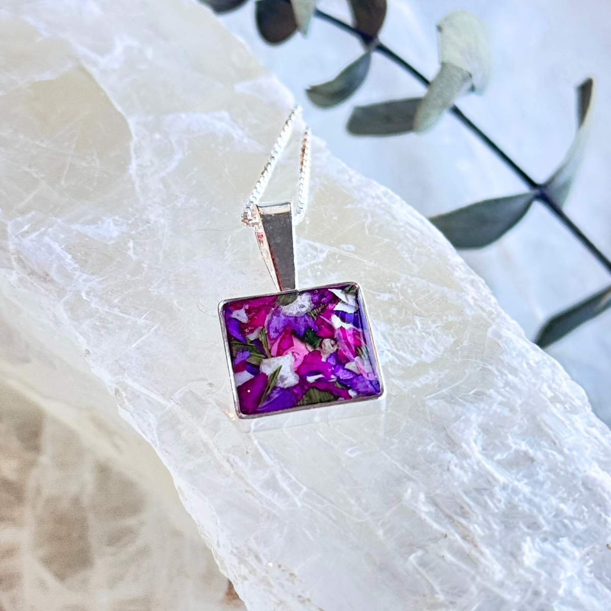 Side view of the Cherished Square Pendant showcasing preserved flowers