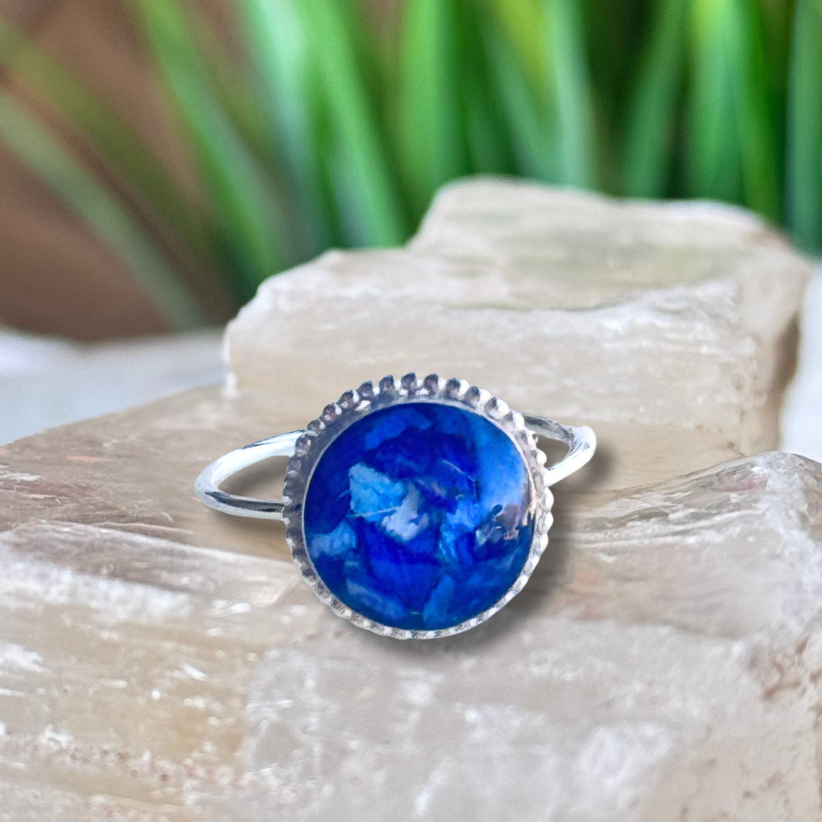Circle of Memories Ring featuring a round keepsake setting handcrafted from preserved flowers or cremation ashes in a sterling silver ring.