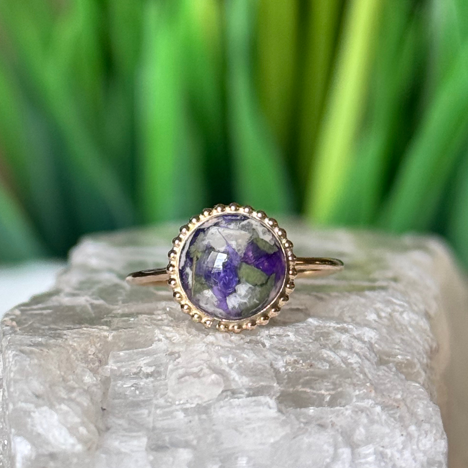 A handcrafted gold Circle of Memories Ring, designed as a memorial jewelry keepsake. Inspired by funeral flowers, symbolizing love and remembrance.