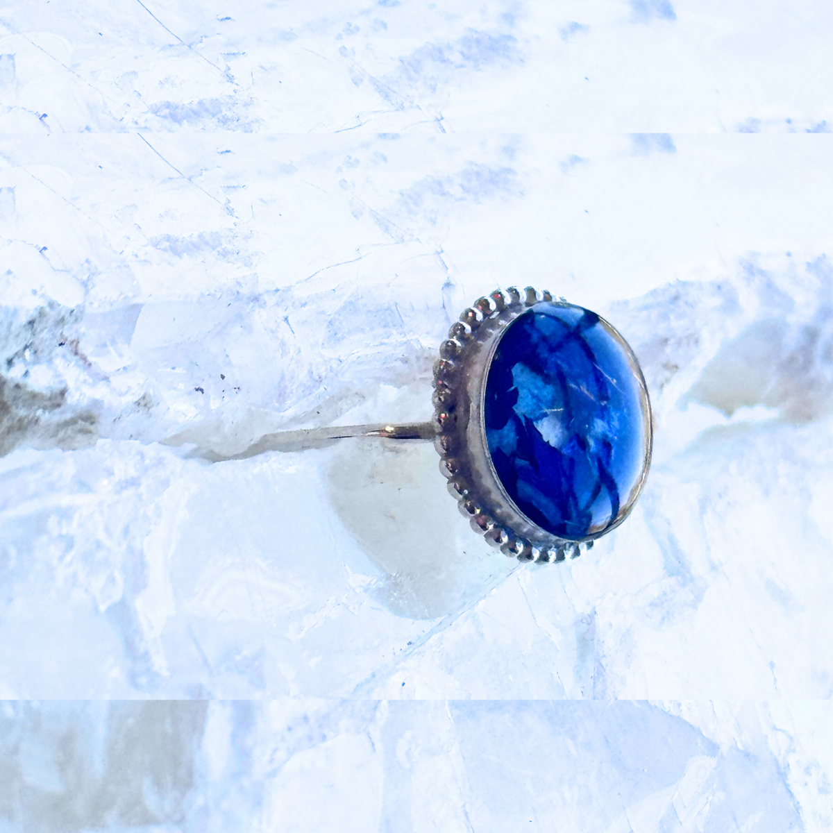 Side view of the Circle of Memories Ring highlighting the preserved flowers and elegant band design.