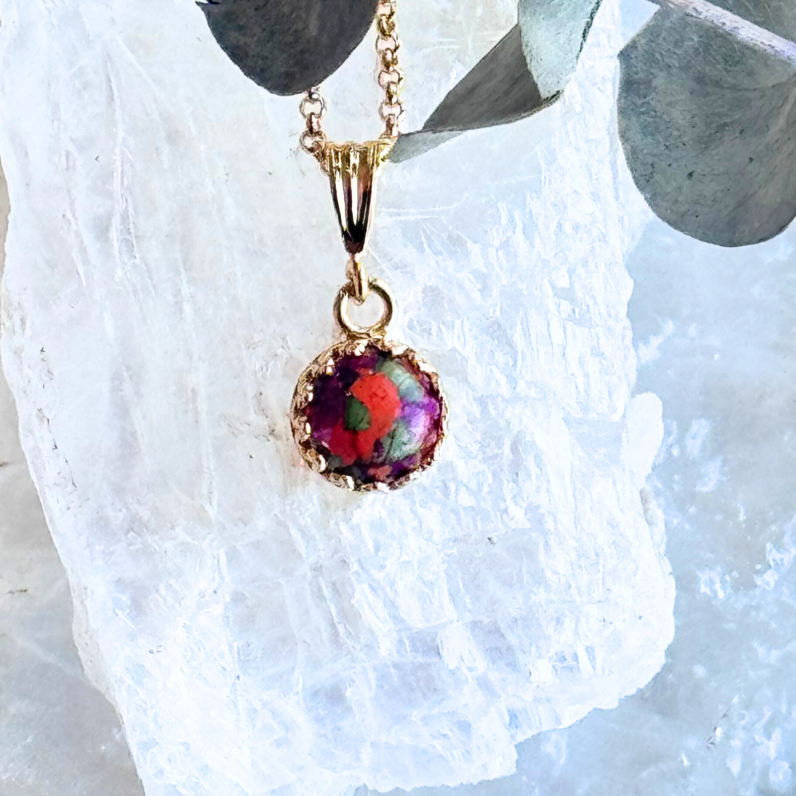 Front view of the Crown of Memories Pendant featuring preserved flowers in a gold-plated crown setting.