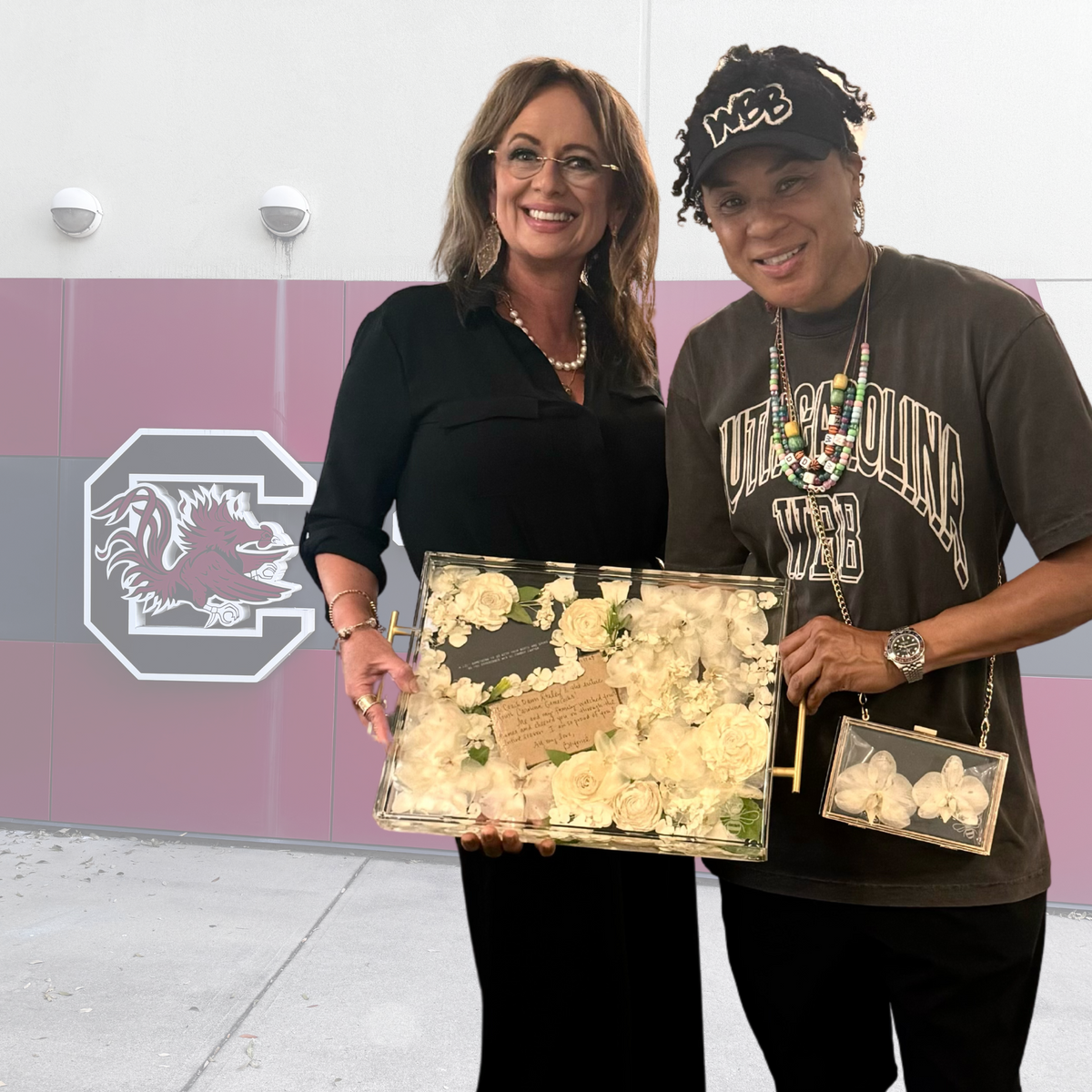 Dawn Staley with preserved flowers gifted by Beyoncé, crafted into a keepsake.