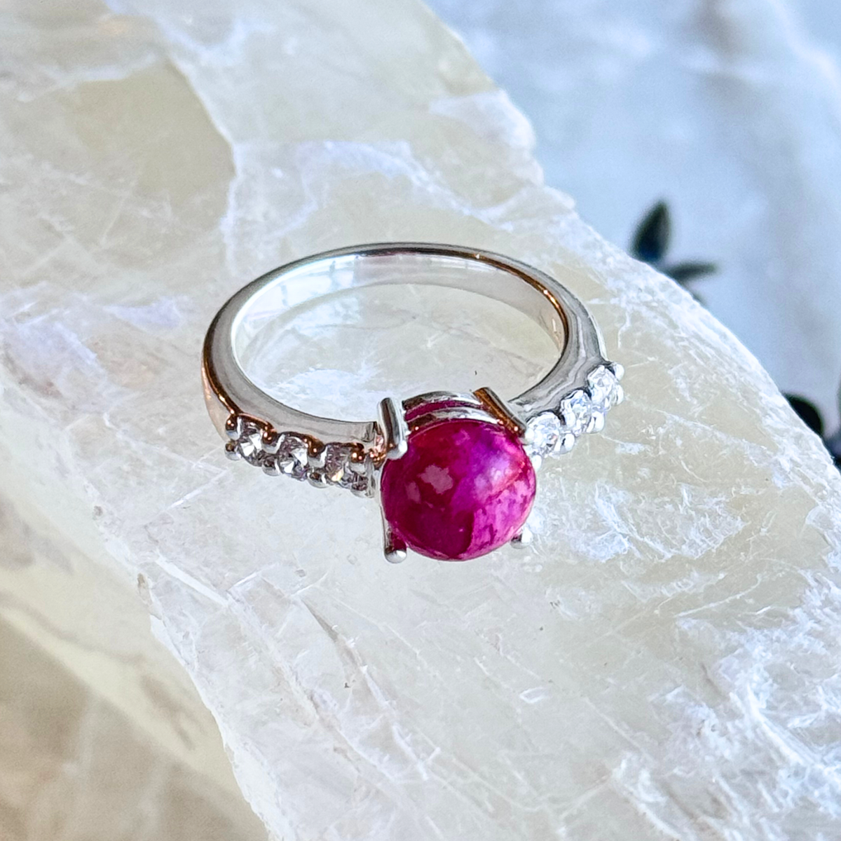 A delicate pink rose-infused stone set in the Eternity Bloom Memorial Ring, symbolizing love and remembrance. A heartfelt memorial jewelry piece honoring cherished connections.