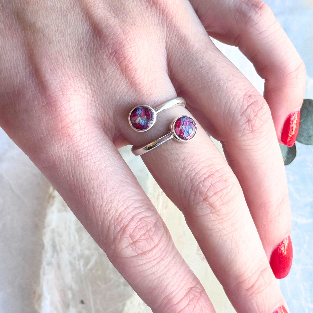 Model wearing the Forever Grace Ring, featuring preserved flowers in an elegant double-stone design.