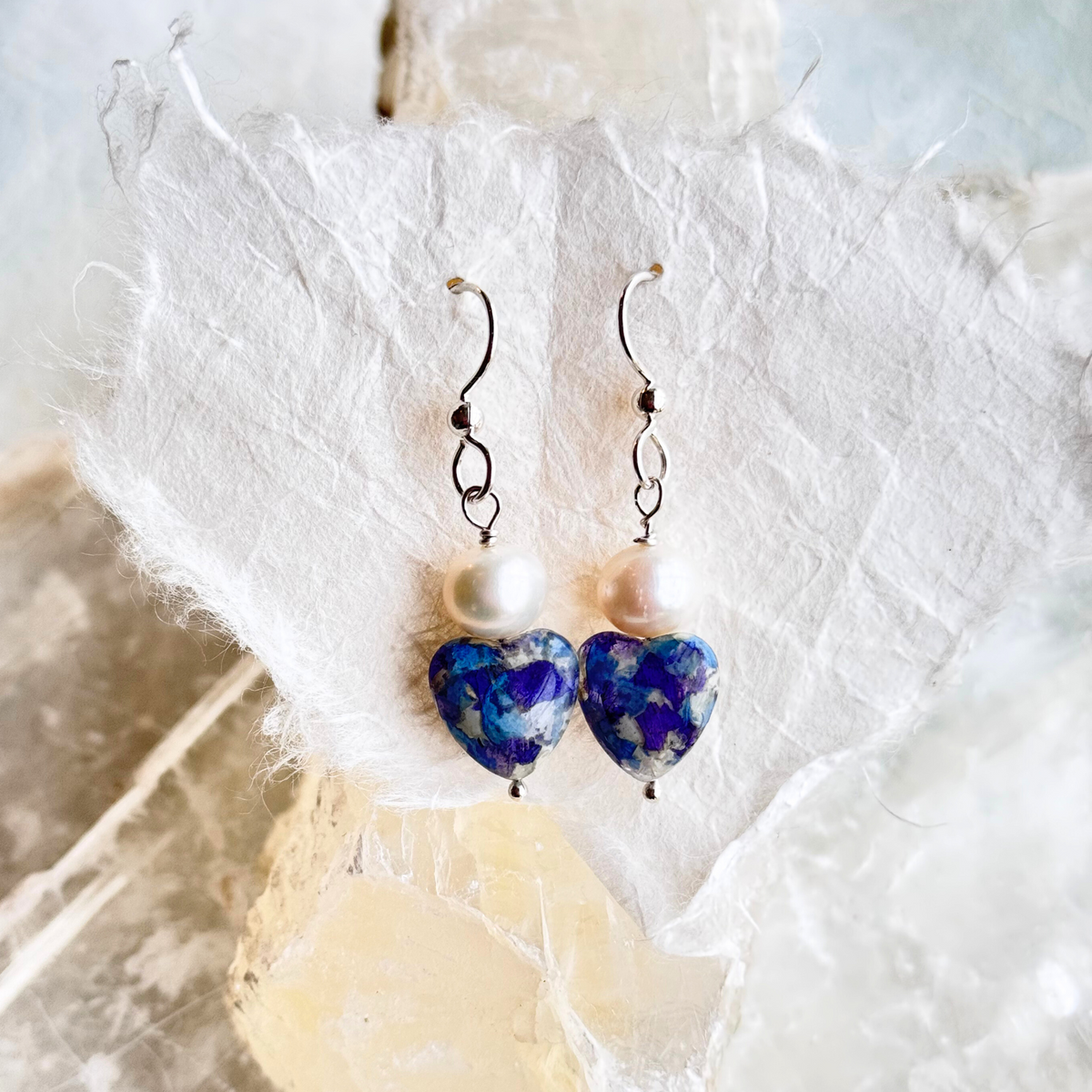 Close-up of Forever Heart and Pearl Earrings showing floral design and pearl details