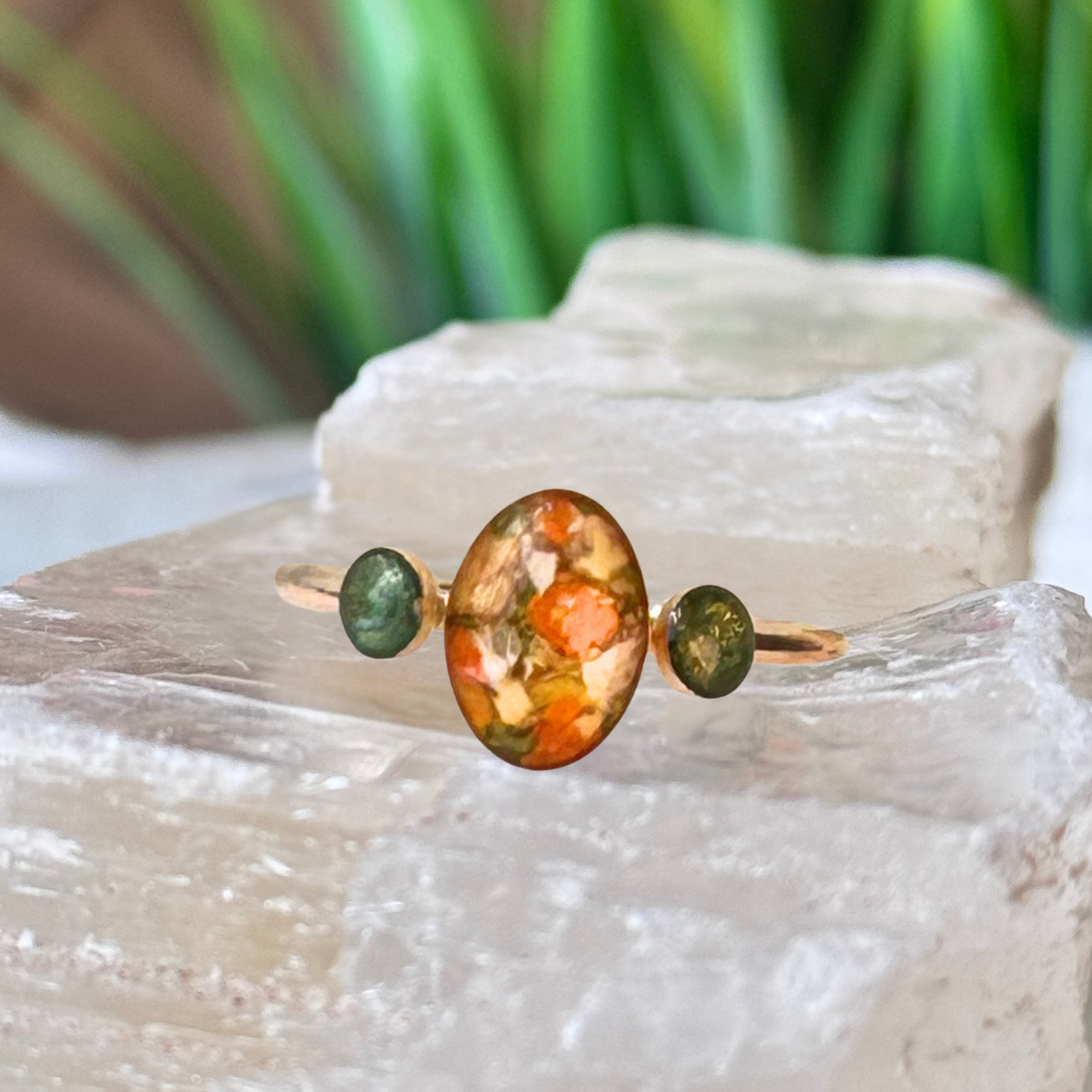 Gold-plated Everleaf Keepsake Ring featuring preserved flowers in an 8x10mm oval center setting with two 5mm memorial settings for cremation ashes, handcrafted by Flowers Forever