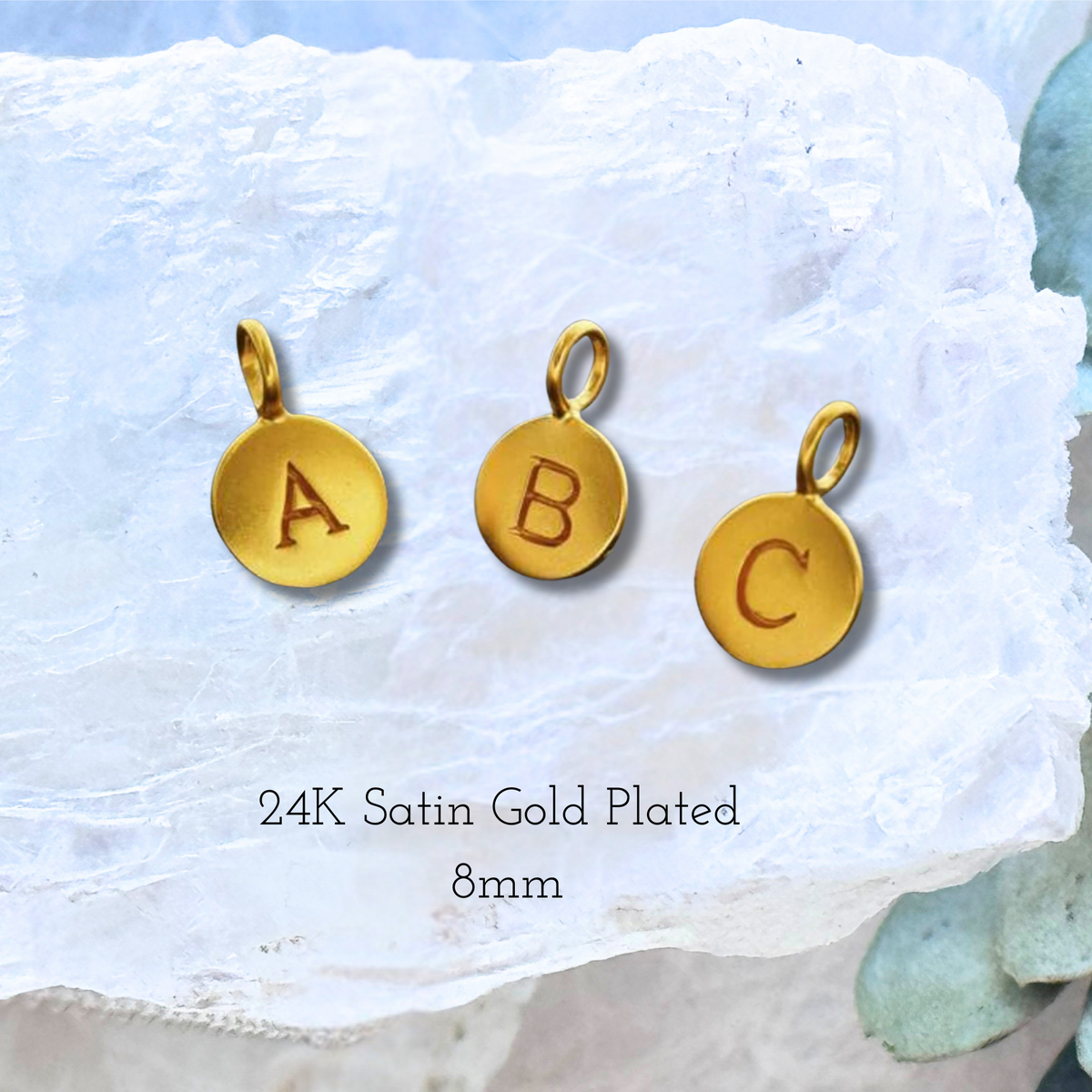 Gold initial charm for customizing the minimalist round pendant.