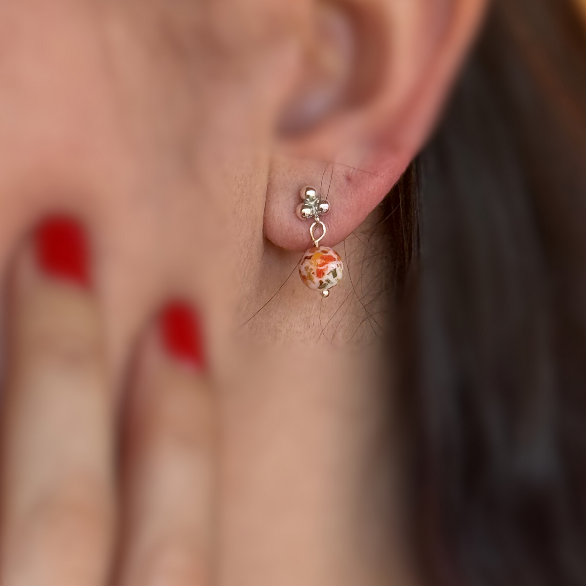 Model wearing Graceful Memory Earrings made with preserved flowers