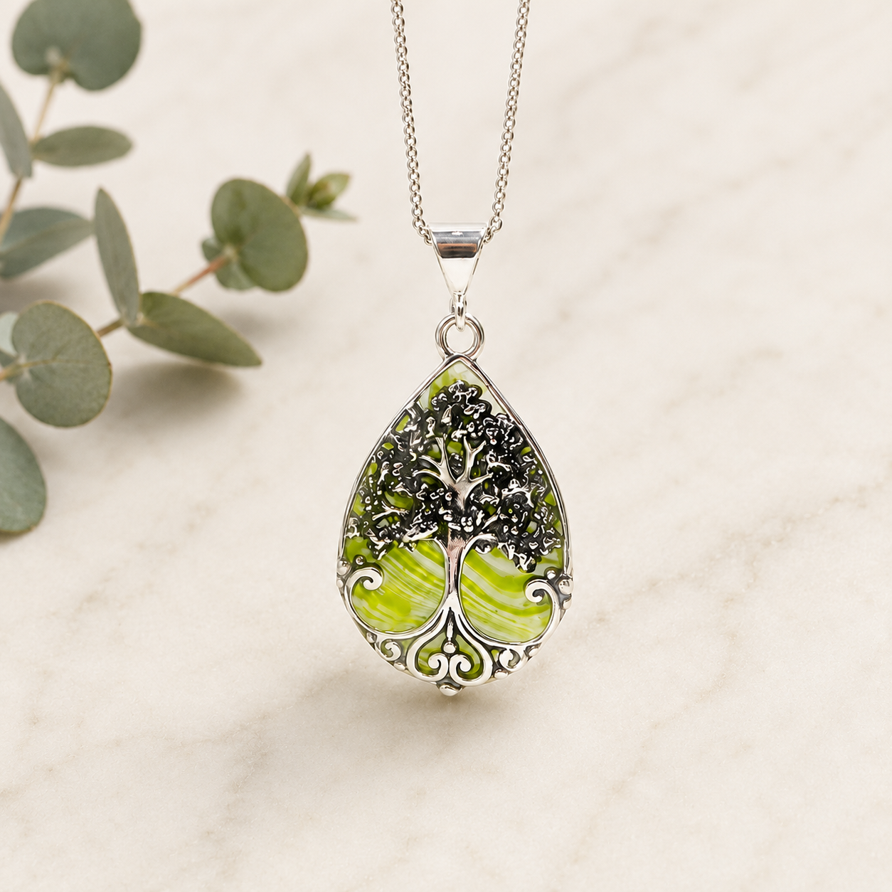 Harper Tree of Life memorial pendant handcrafted with preserved wedding flowers or funeral flowers, creating a custom sterling silver keepsake necklace with real flowers, ashes, or hair.