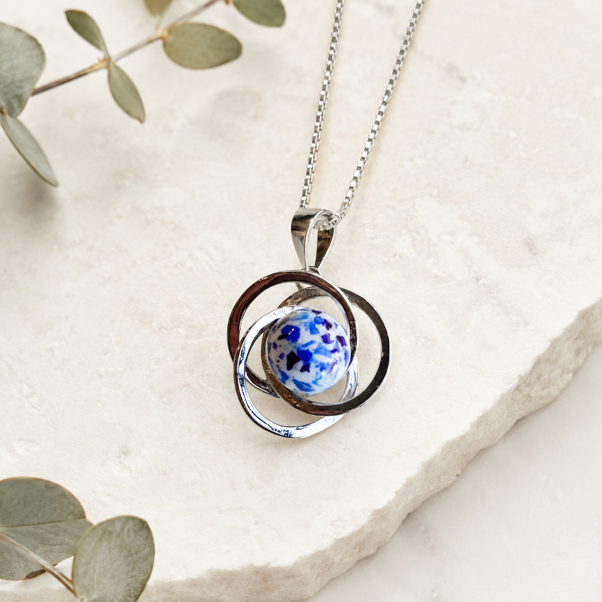 Infinity Knot Pendant handcrafted in sterling silver with a custom memorial Bellabead made from preserved wedding flowers or funeral flowers, creating a timeless keepsake necklace.