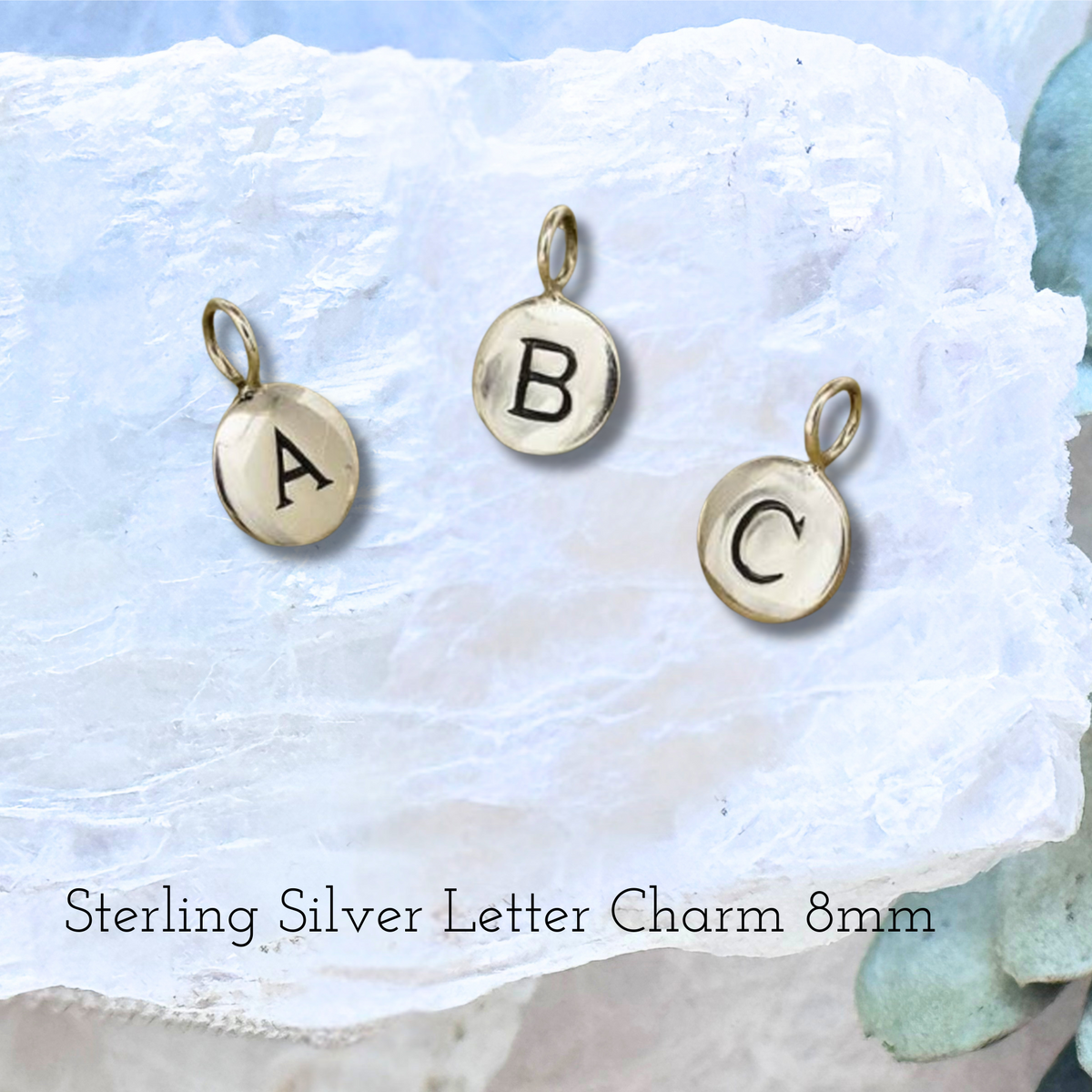 Custom initial charm to add a personal touch to memorial pendants.