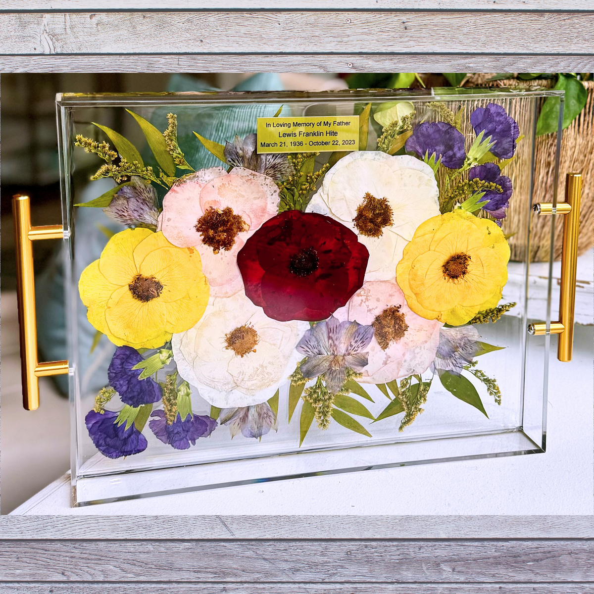 Memorial flowers preserved in a custom acrylic tray as a lasting keepsake.