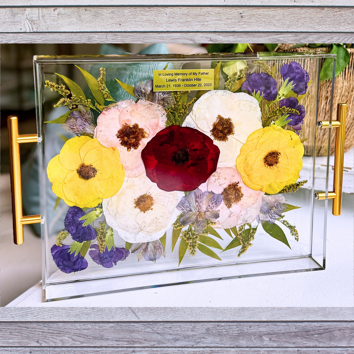 A custom resin tray featuring preserved funeral flowers, offering a unique and sentimental way to honor a loved one.