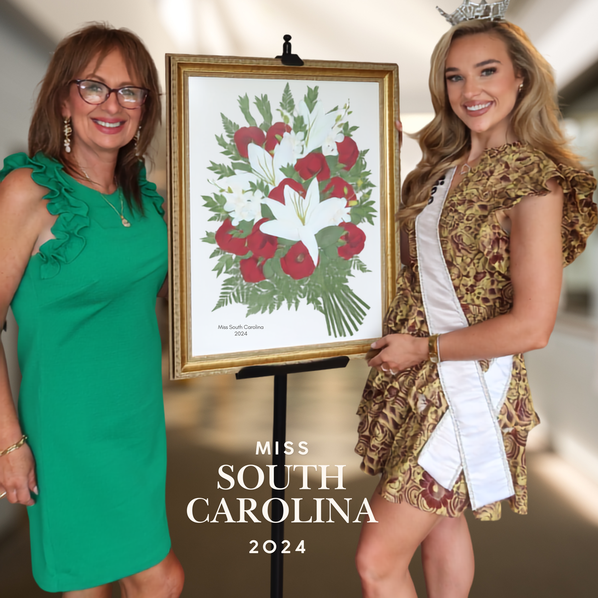 Cristina Segarra and Miss South Carolina posing with custom framed pressed flower artwork created from the Miss South Carolina bouquet, handcrafted with preserved roses, lilies, and greenery.