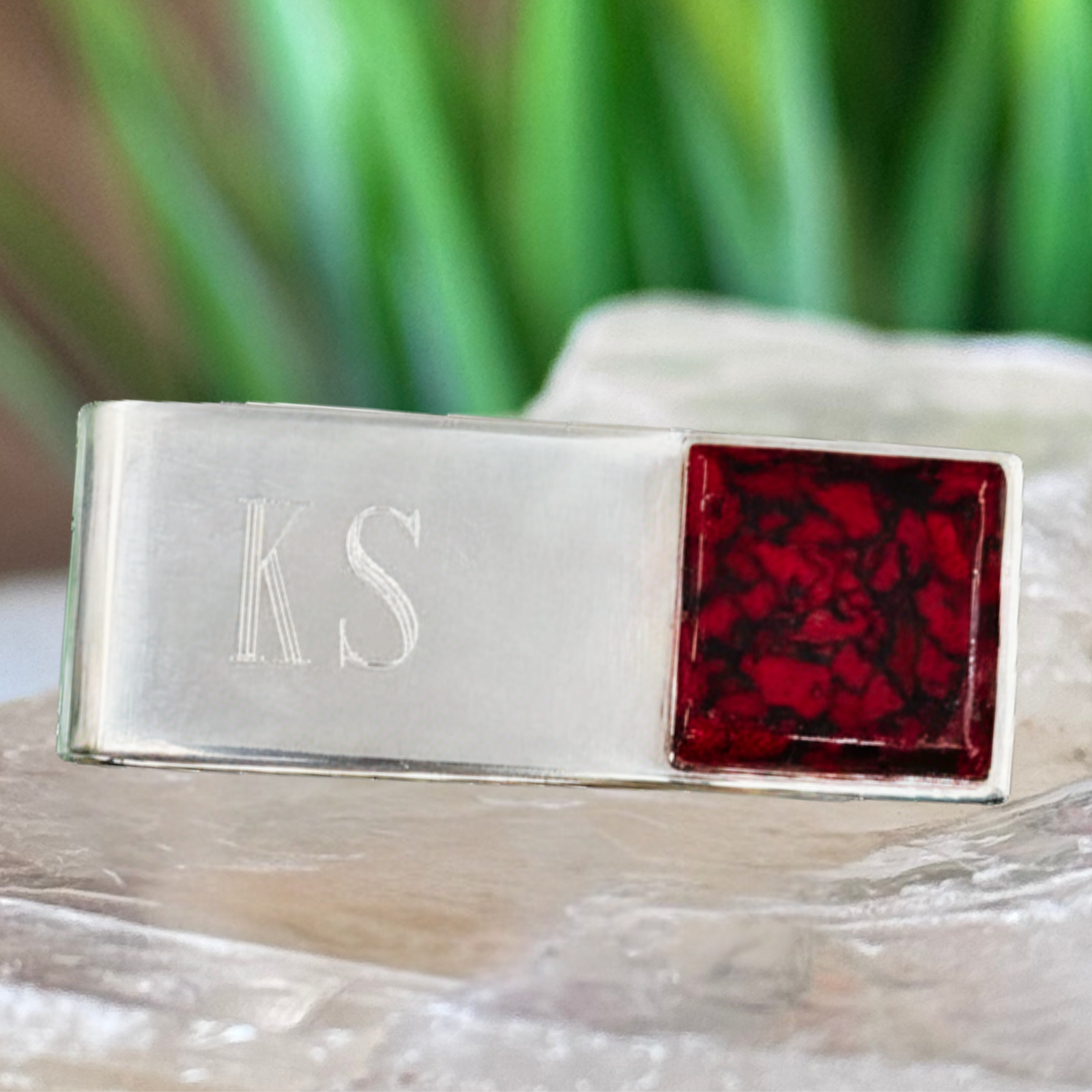 Sterling silver memorial money clip engraved with initials and handcrafted with preserved red flower petals, creating a personalized keepsake from wedding flowers, funeral flowers, or memorial flowers.