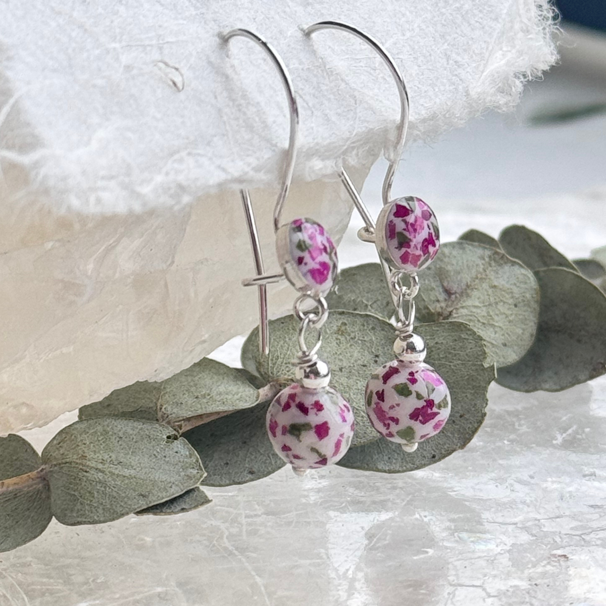 Close-up of Petal Drop Earrings showing floral bead details