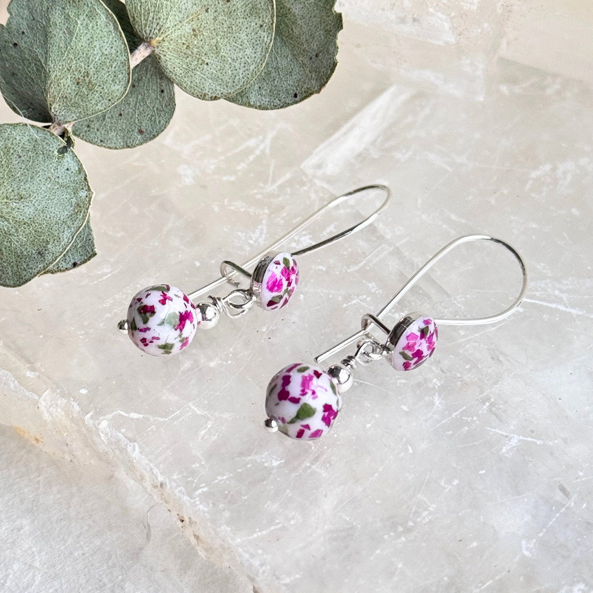 Side view of Petal Drop Earrings featuring floral beads made from preserved flowers