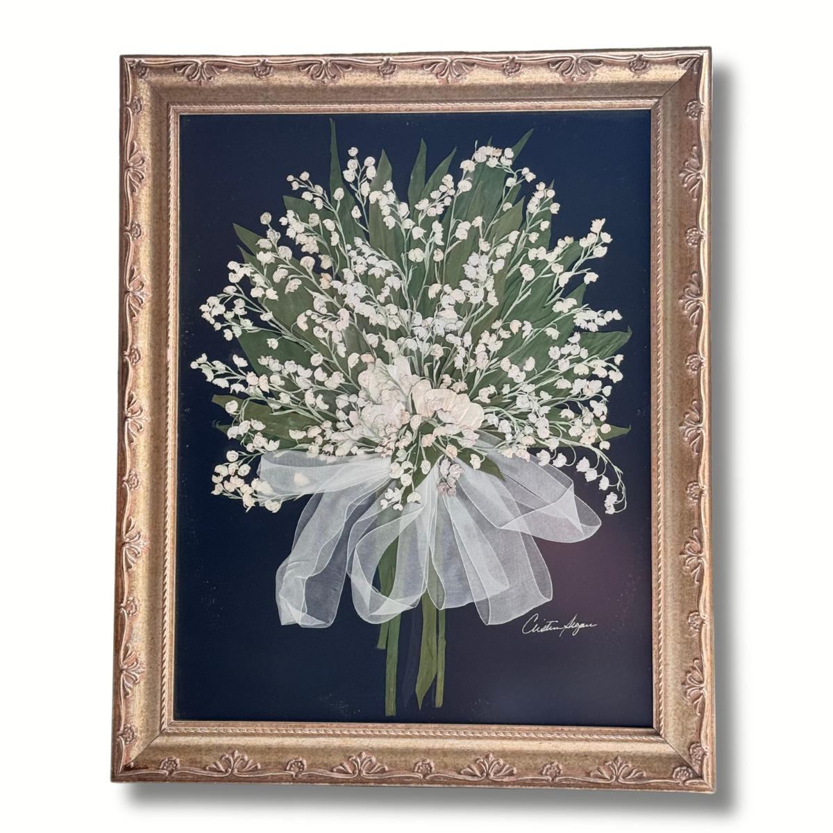 11x14 pressed Lily of the Valley wedding bouquet with white ribbon on navy background in ornate gold frame – elegant bridal preservation piece