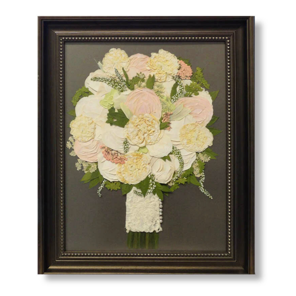 11x14 pressed flower art featuring a round bridal bouquet with cream and blush flowers, greenery, and lace-wrapped stems in dark beaded frame