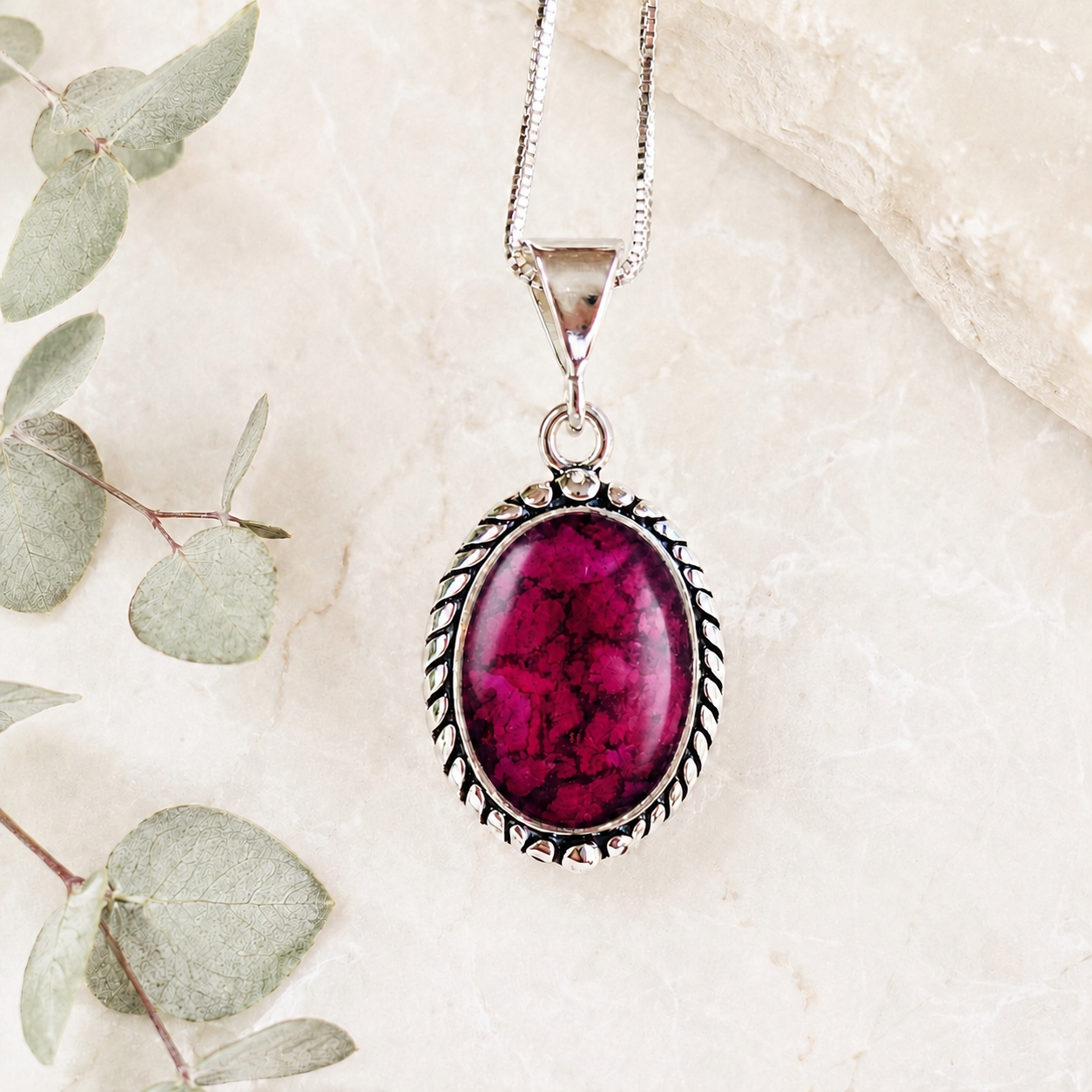 Serene Memorial Pendant handcrafted in sterling silver with preserved funeral flowers or wedding flowers, creating a custom memorial keepsake necklace with real flowers, ashes, or hair.