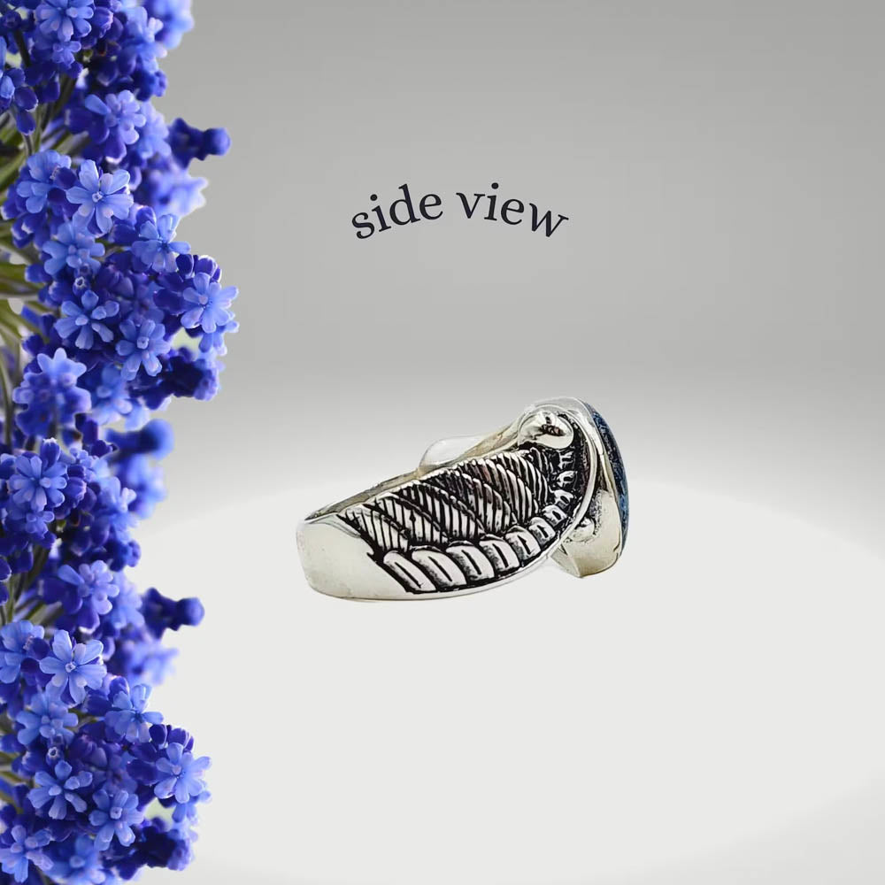 Side view of the Seraphina Memorial Ring with sterling silver band and wing detail, showcasing the preserved flower inlay.