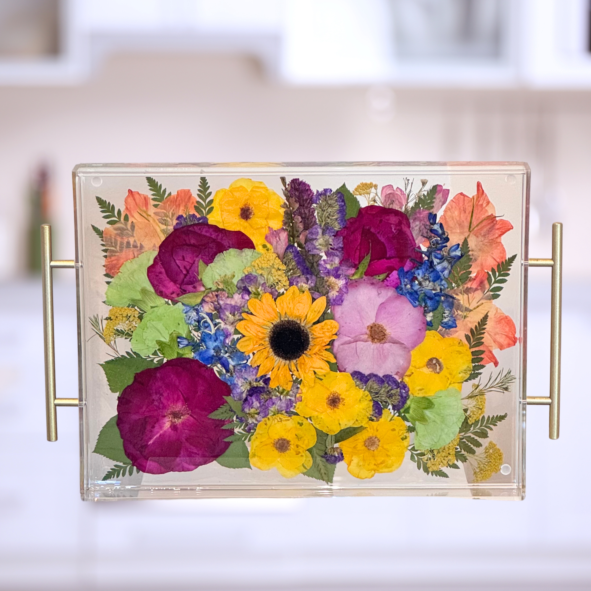 A handmade resin tray featuring preserved bright funeral flowers, creating a meaningful keepsake to honor a loved one’s memory.