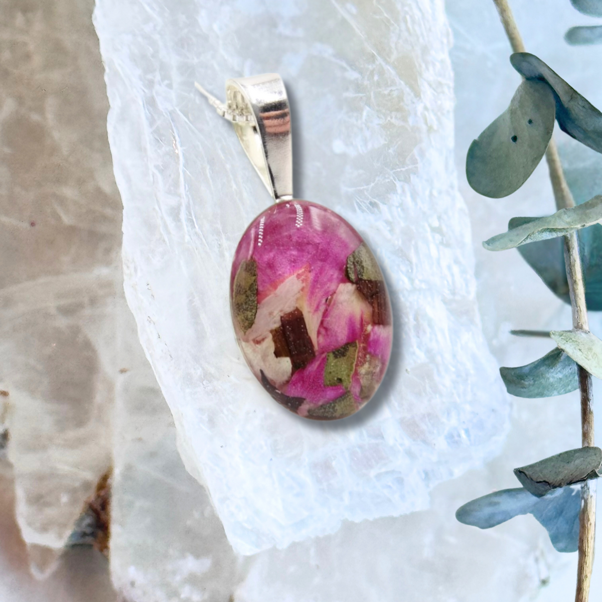 Close-up of the Timeless Floral KeepsakePendant showcasing detailed preserved flowers in a sterling silver frame.