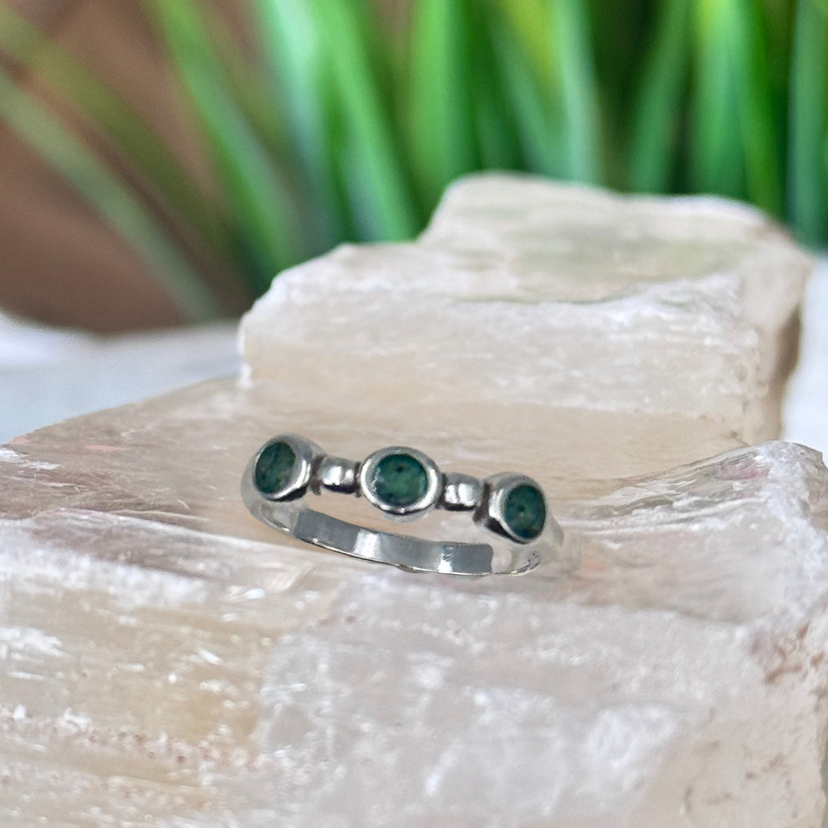 Top view of the Trinity Keepsake Ring featuring three cremation ash keepsake settings handcrafted in sterling silver.