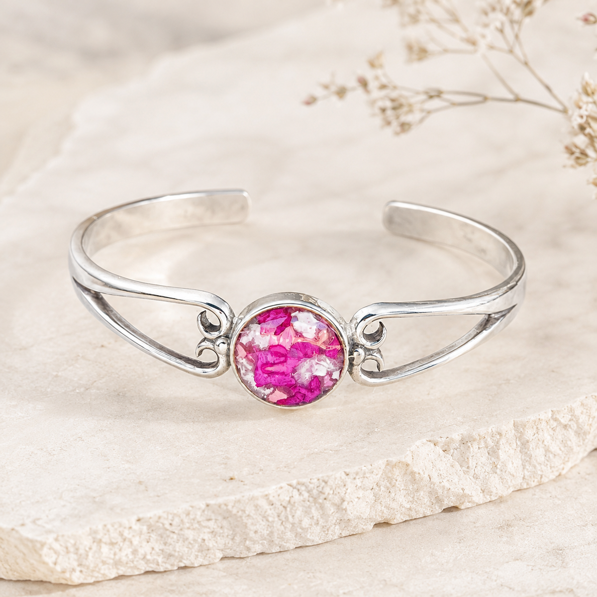 Unity Memorial Bracelet handcrafted in sterling silver with a preserved flower centerpiece. Custom memorial cuff bracelet made with wedding flowers, funeral flowers, ashes, or pet fur.