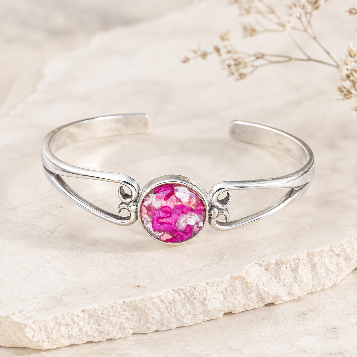 Unity Memorial Bracelet handcrafted in sterling silver with a preserved flower centerpiece. Custom memorial cuff bracelet made with wedding flowers, funeral flowers, ashes, or pet fur.