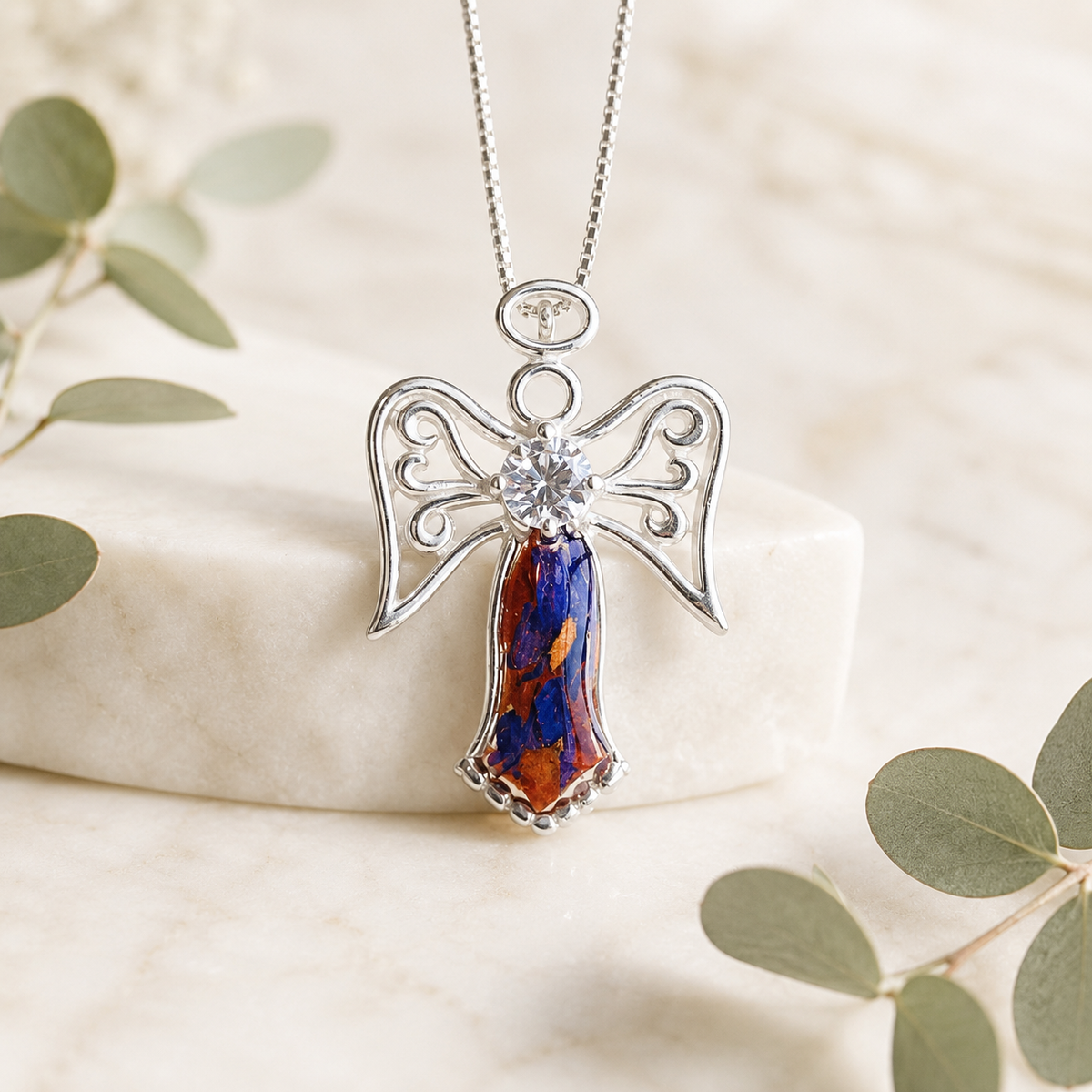 Wings of Light Pendant handcrafted with preserved wedding flowers or funeral flowers, creating a custom angel memorial necklace with real flowers, ashes, or hair in sterling silver.