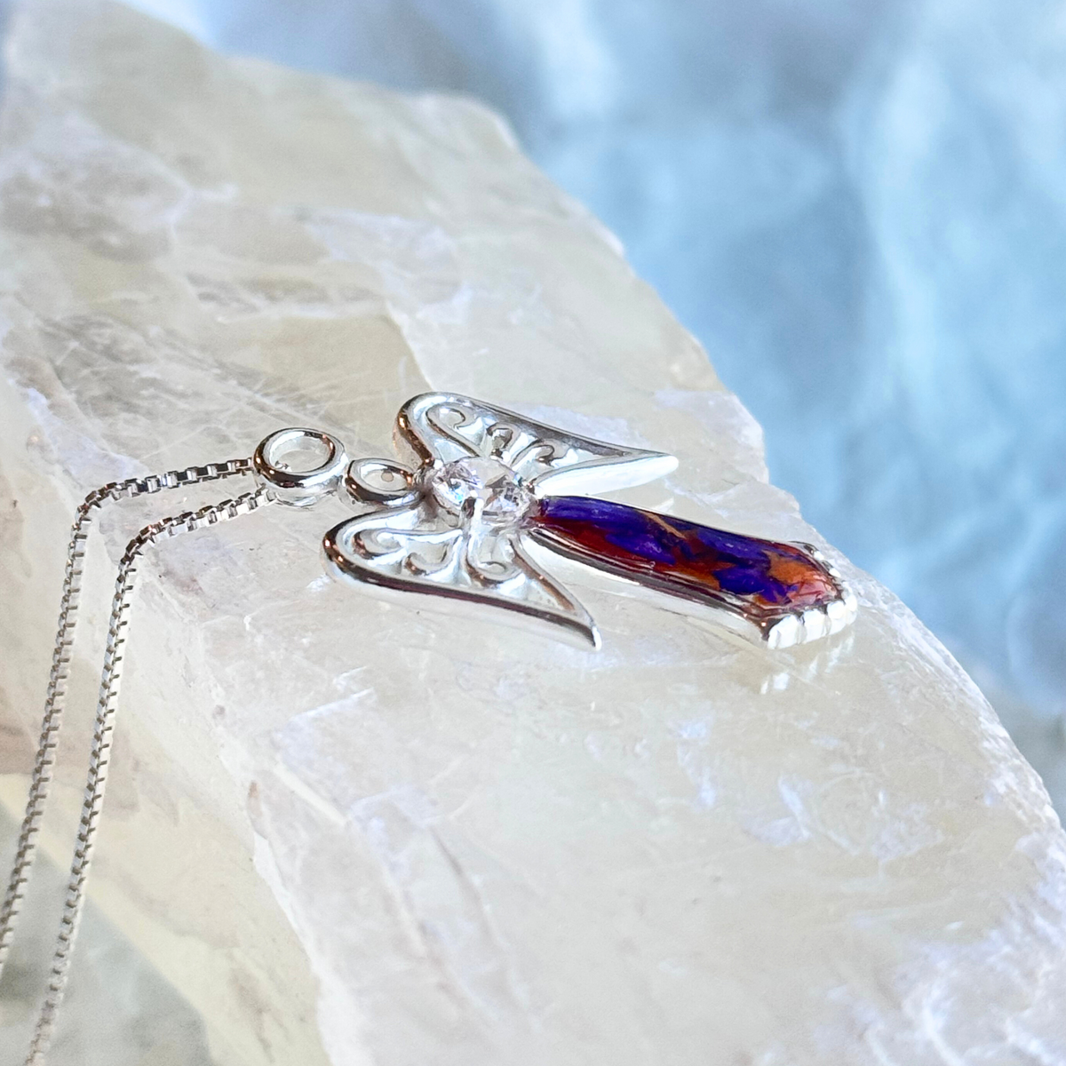 Side view of the Wings of Light Pendant featuring real preserved flowers