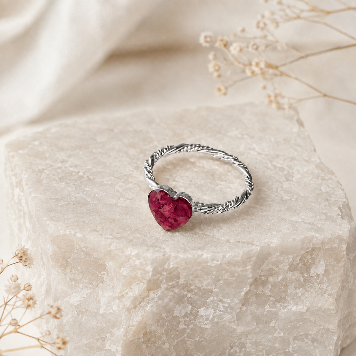 Beloved Heart Keepsake Silver Ring with pink preserved flowers in a heart-shaped setting.