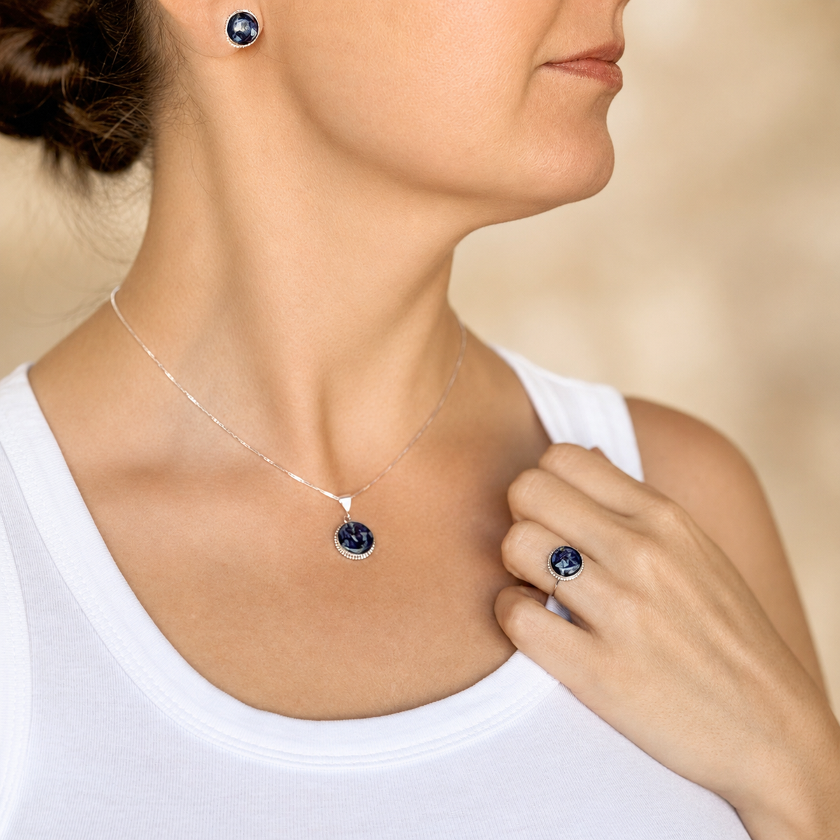 Model wearing the Circle of Memories Ring with matching pendant and earrings