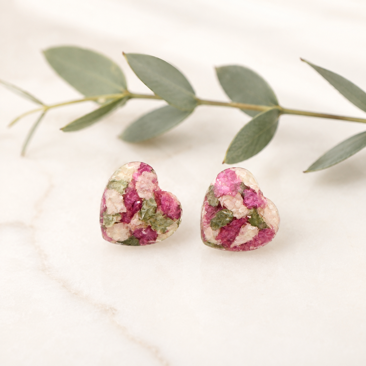 Crystal Heart Memorial Posts with pink, white and green preserved flowers.