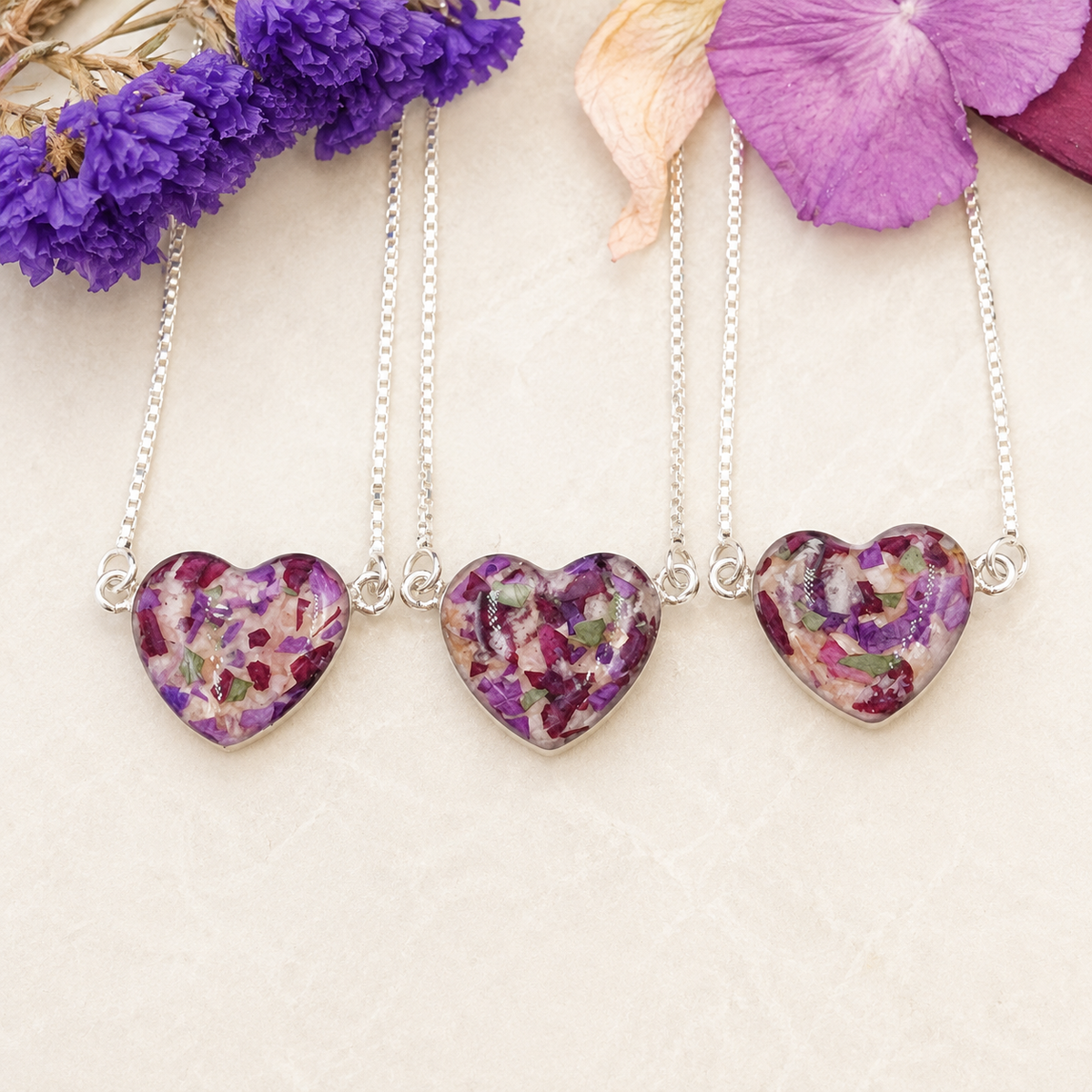 Three Demi Heart Memorial Bracelets with colorful preserved flowers.