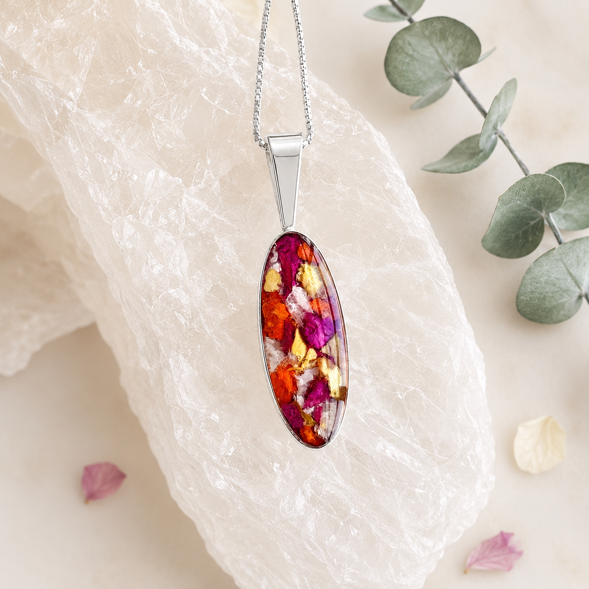 Eternal Grace Pendant with pink, orange, yellow and white preserved flowers.