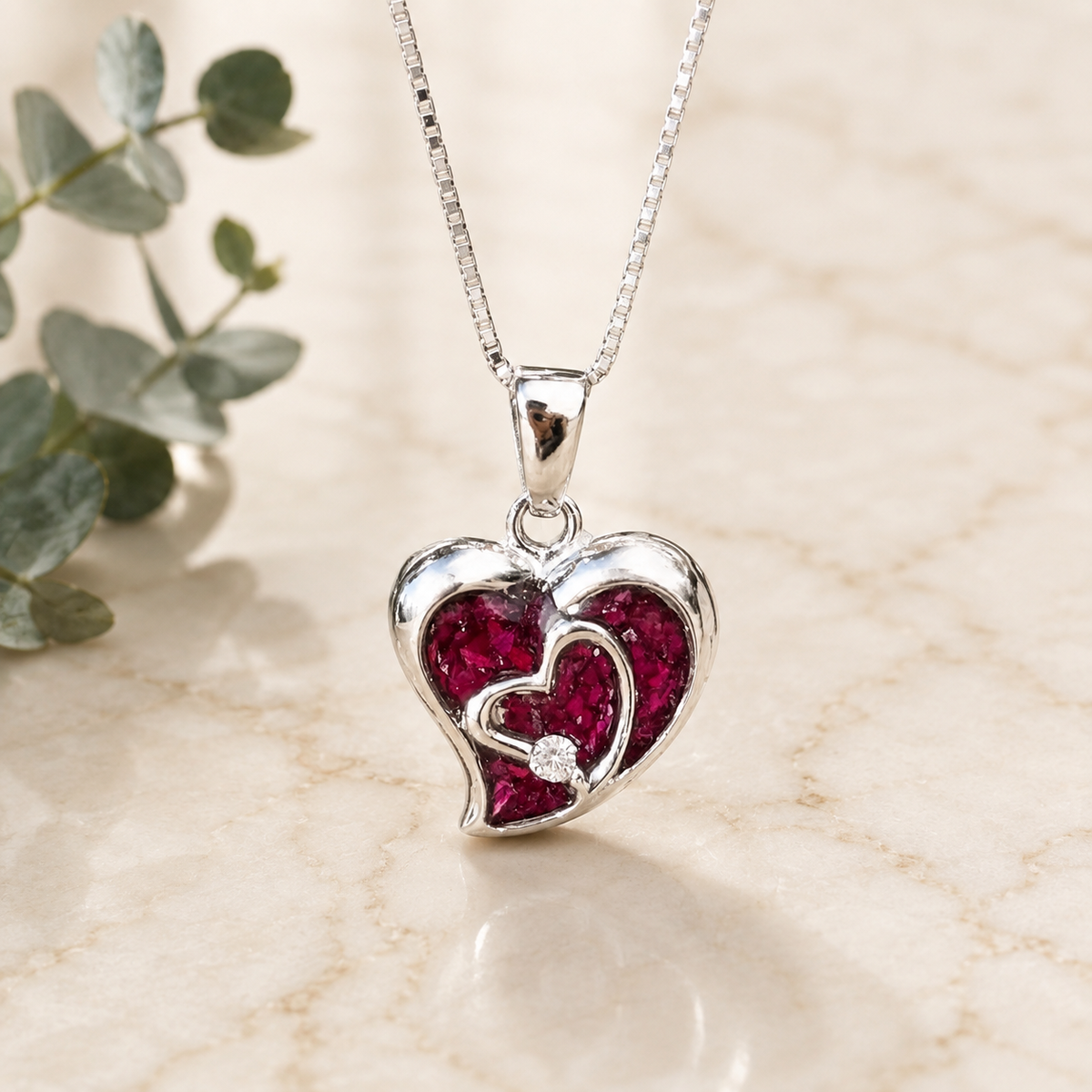 Everlasting Heart Pendant with pink preserved flowers in a silver heart setting