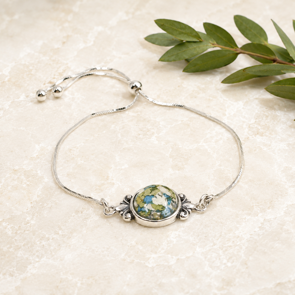Fleur de Lis Heirloom Bracelet with blue, white and green preserved flowers.