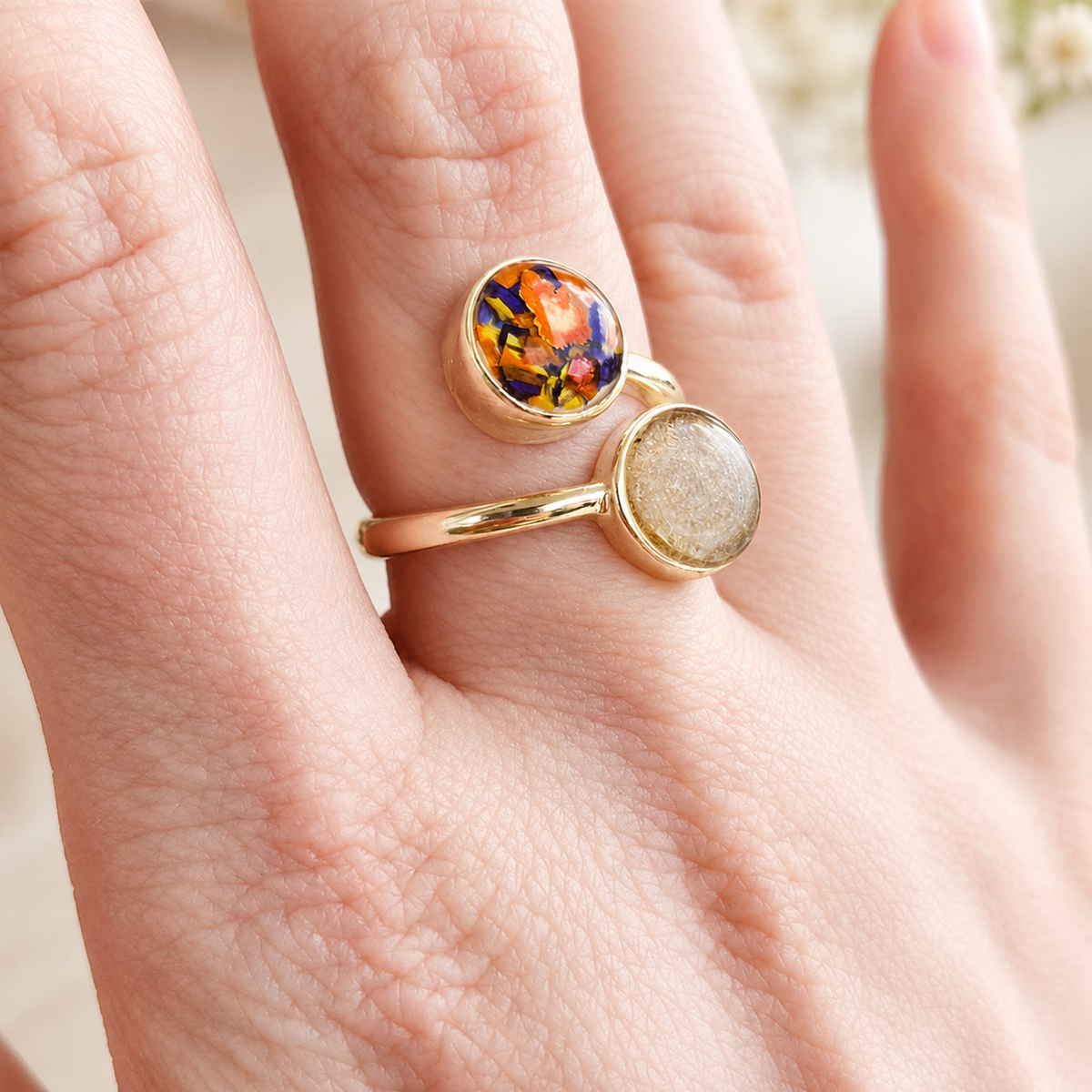 Model wearing Forever Grace Ring with colorful preserved flowers and hair in gold settings.