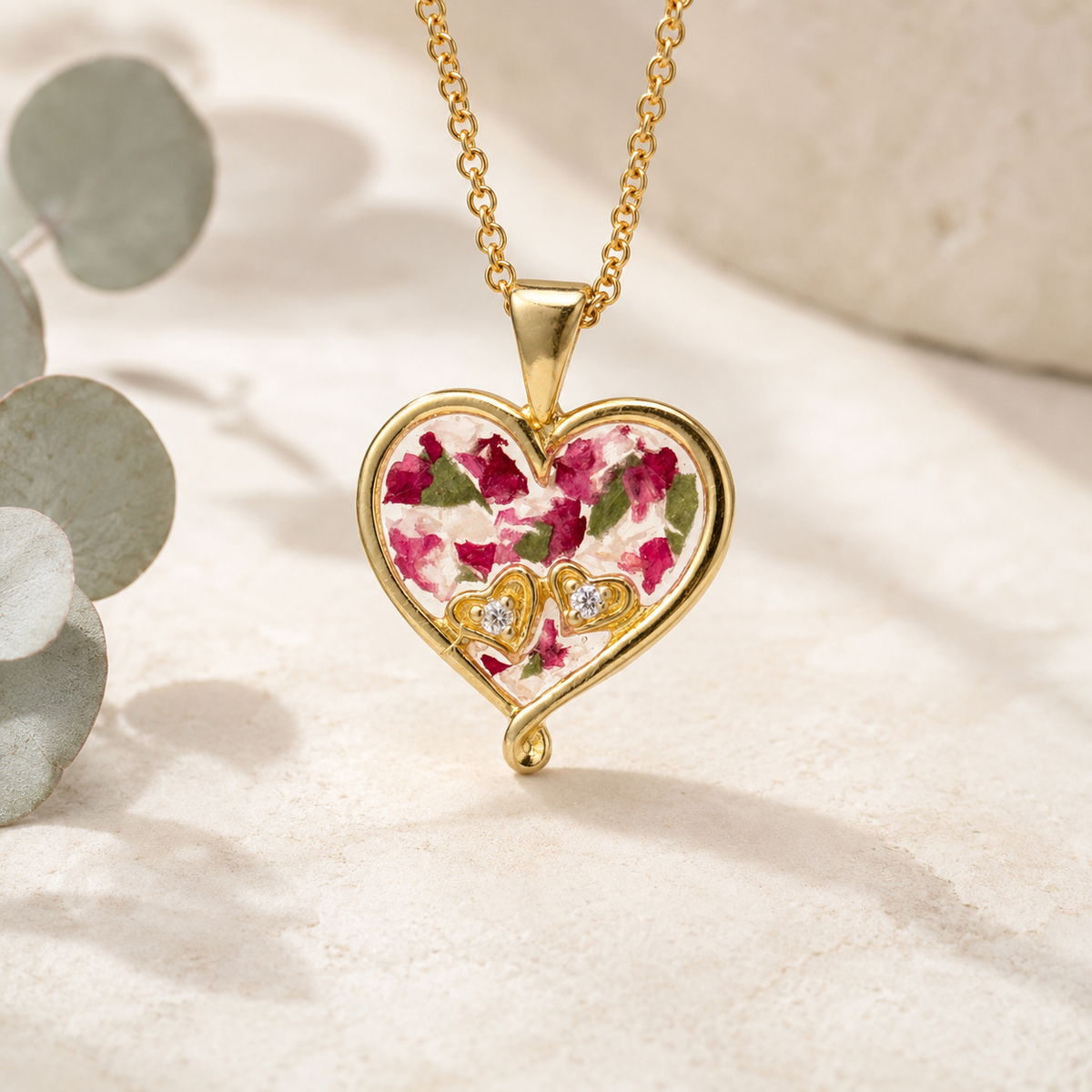 My Heart in Yours Memorial Pendant with pink and green preserved flowers in a gold heart setting.
