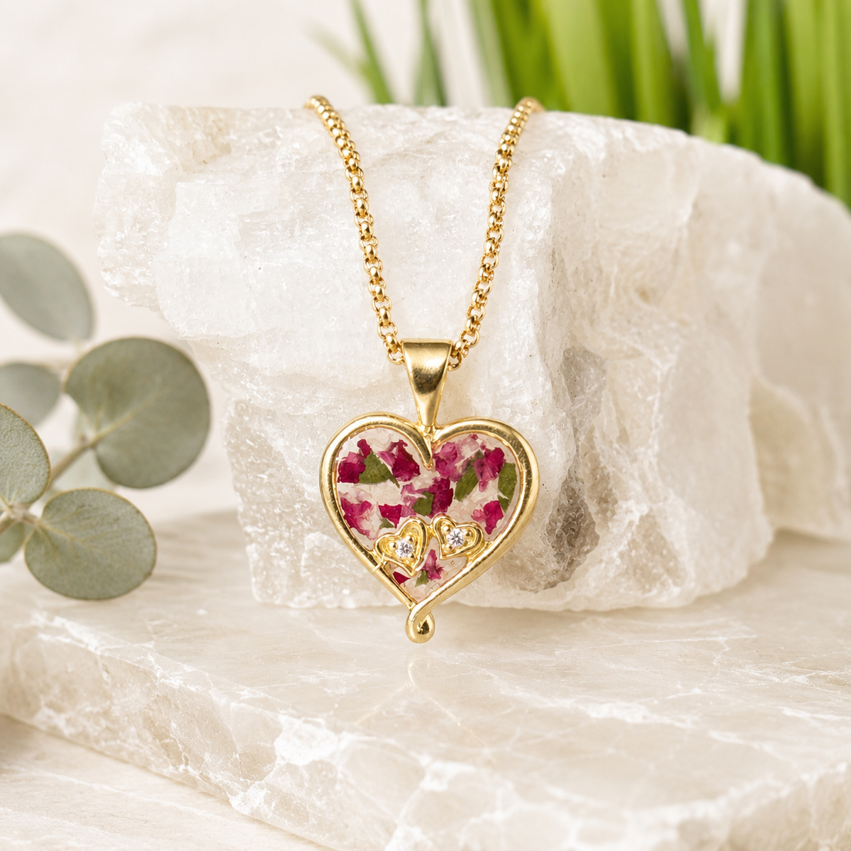 My Heart in Yours Memorial Pendant with pink and green preserved flowers in a gold heart setting.