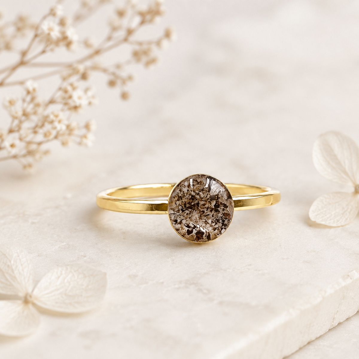 Petite Eternity Gold-Plated Stackable Ring with memorial ashes in a round setting.
