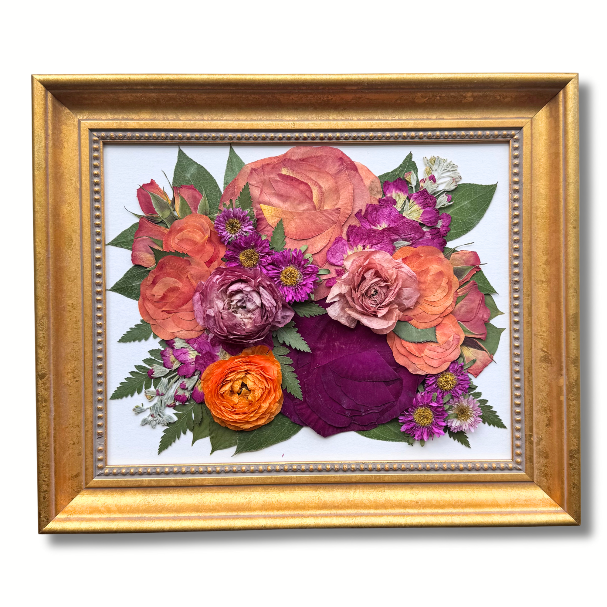Pressed flower art in an 8x10 gold frame featuring preserved roses, ranunculus, daisies, and asters in vibrant shades of orange, purple, and blush, designed by Flowers Forever for wedding or memorial keepsakes.