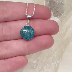 A video showcasing the “Loyal Companion” round pet memorial ash pendant from all angles — front, side, and back — highlighting craftsmanship and detail.