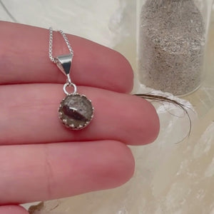 A video showing the Ever Close pet memorial pendant made with ashes and hair, displayed from multiple angles to highlight its handcrafted detail and sterling silver setting